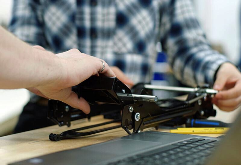 Engineers working on a Clek Car Seat component