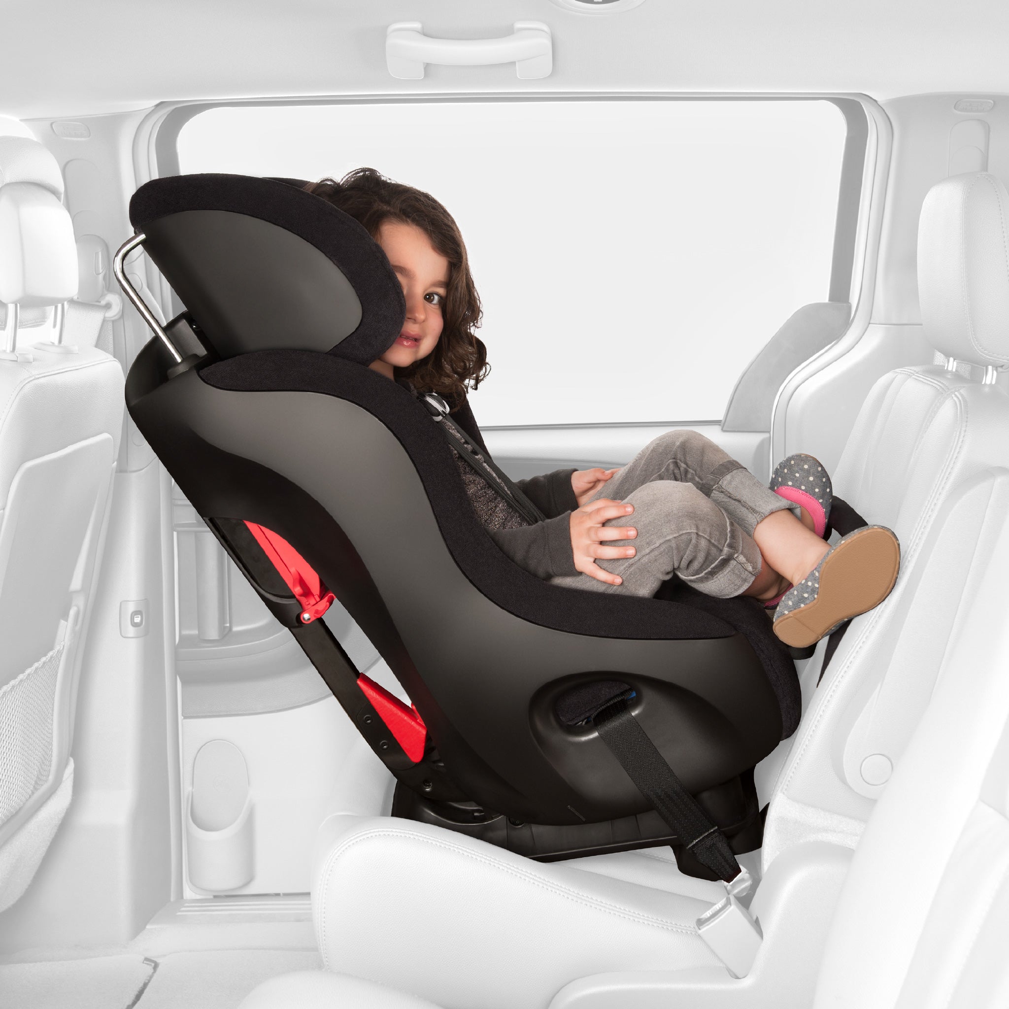 Child sitting rear-facing in a Clek Fllo all-groups