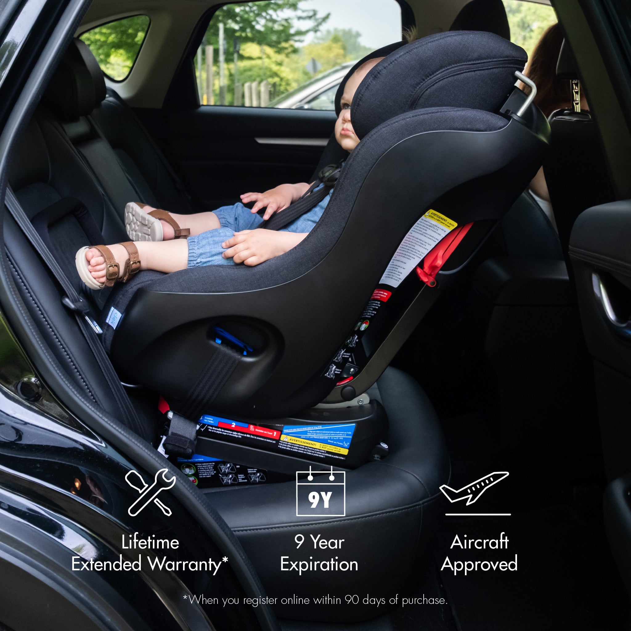 Child secured rear-facing in a Clek Foonf with text indicating a Lifetime Extended Warranty, 9 Year Expiration and Aircraft Approved all-groups