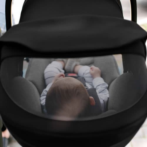 Clek Liingo infant car seat with a mesh viewing window in the canopy cover