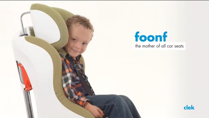 Child sitting in his Clek Foonf convertible car seat