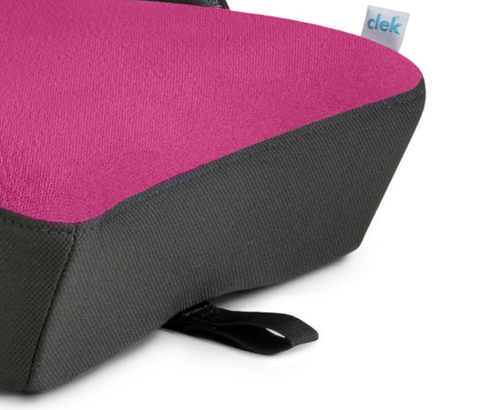 Closeup of the release pull-tab on the Clek Olli booster seat in Flamingo fabric 